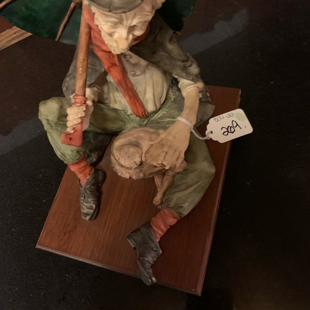 Handcrafted Figurine with Red and Green Accents